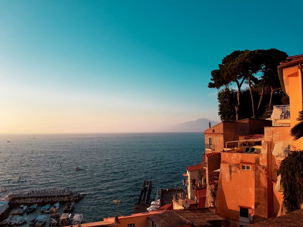 Dawn over the Mediterranean Sea with golden buildings