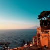 Dawn over the Mediterranean Sea with golden buildings