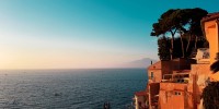 Dawn over the Mediterranean Sea with golden buildings