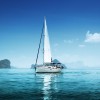 Lean sailboat in blue, protected waters with just the mainsail up