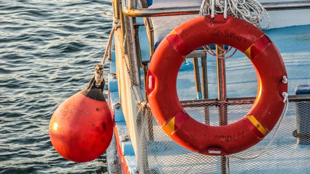 PFD and buoy on board of boat