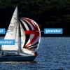 Cruising yacht with mainsail, headsail, and gennaker