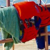 Sailing safety gear hanging from rail on boat
