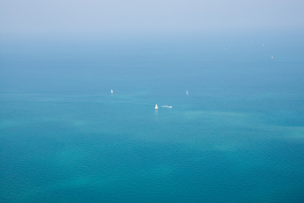 Number of sailboats from birdseye perspective doing offshore sailing