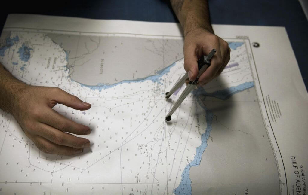 Us Navy 100405 N 5712p 135 Quartermaster 3rd Class Adalberto Fuentes From Galveston Texas Plots A Course On A Coastal Chart In T 