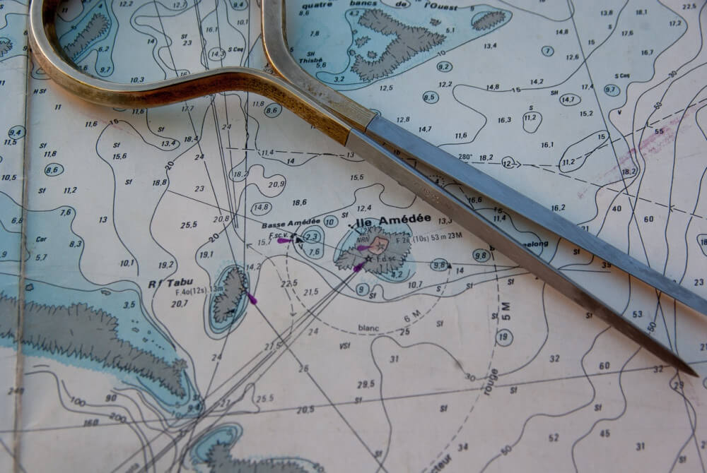 Marine navigation chart with pair of dividers