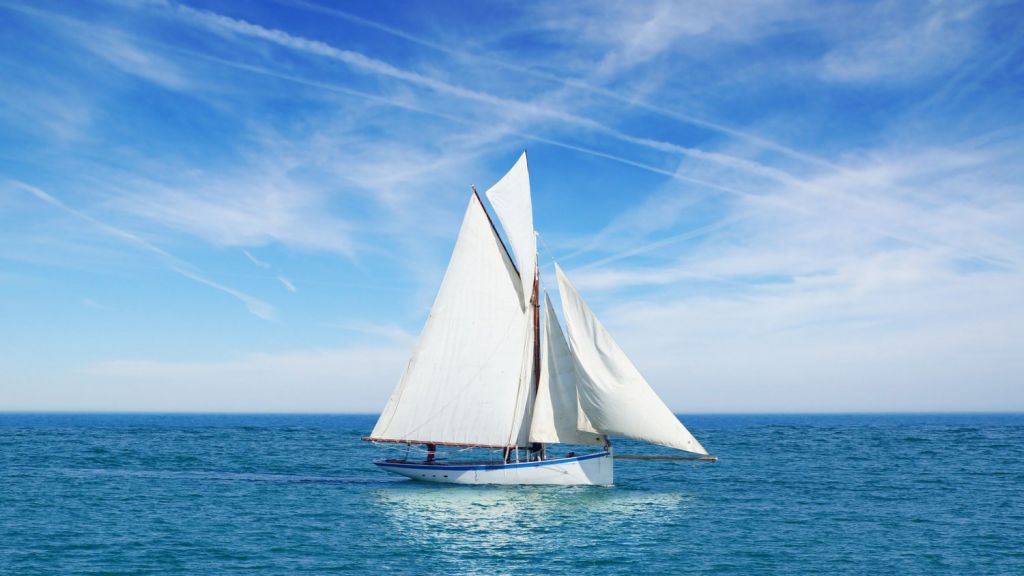 Beautiful white gaff-rigged cutter with gaff top sail and two staysails