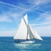 Beautiful white gaff-rigged cutter with gaff top sail and two staysails