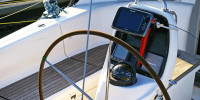 Chartplotter and compass at wheel of the boat