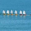 Sail instructor tows seven dinghies with a powerboat