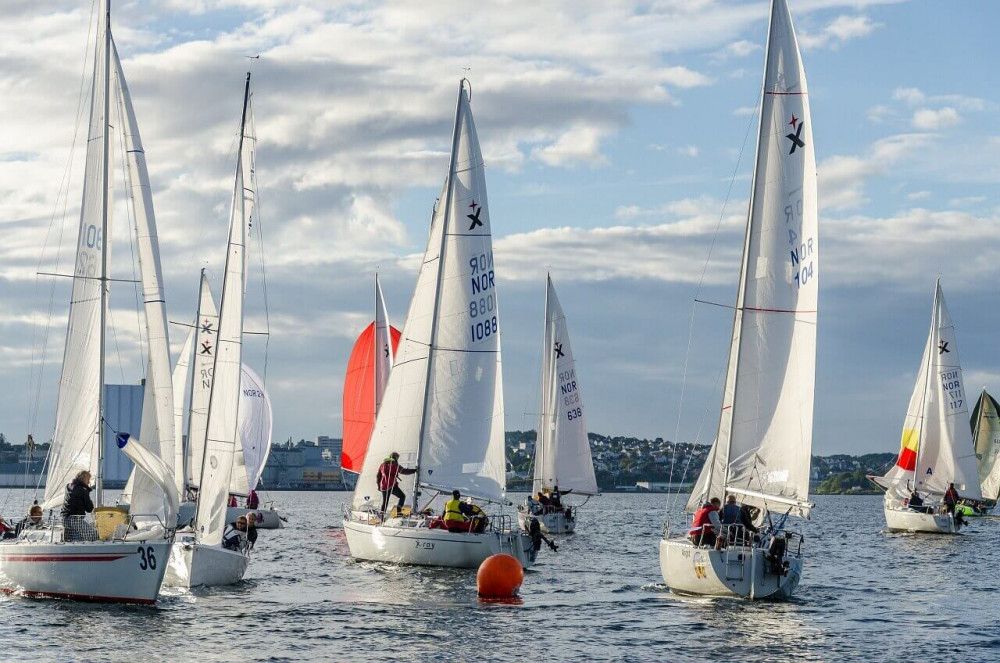 Sailing regatta with dozen sailboats in race