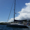 OVNI aluminum sailboat at anchor in calm bay