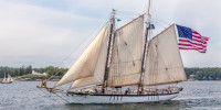 Gaff rigged white schooner
