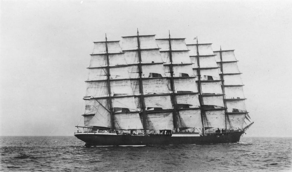 Black and white image of five masted tall ship