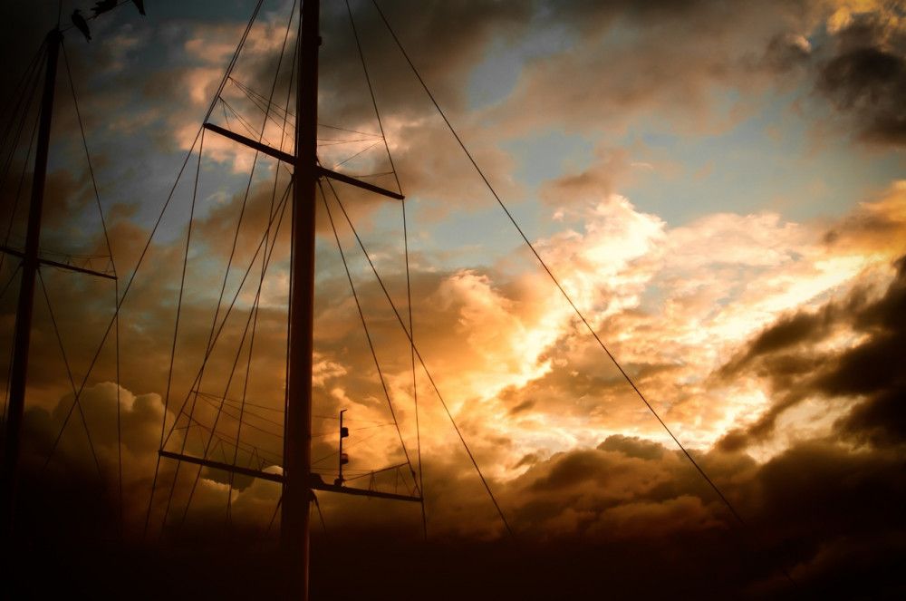 Sunset with clouds and mast