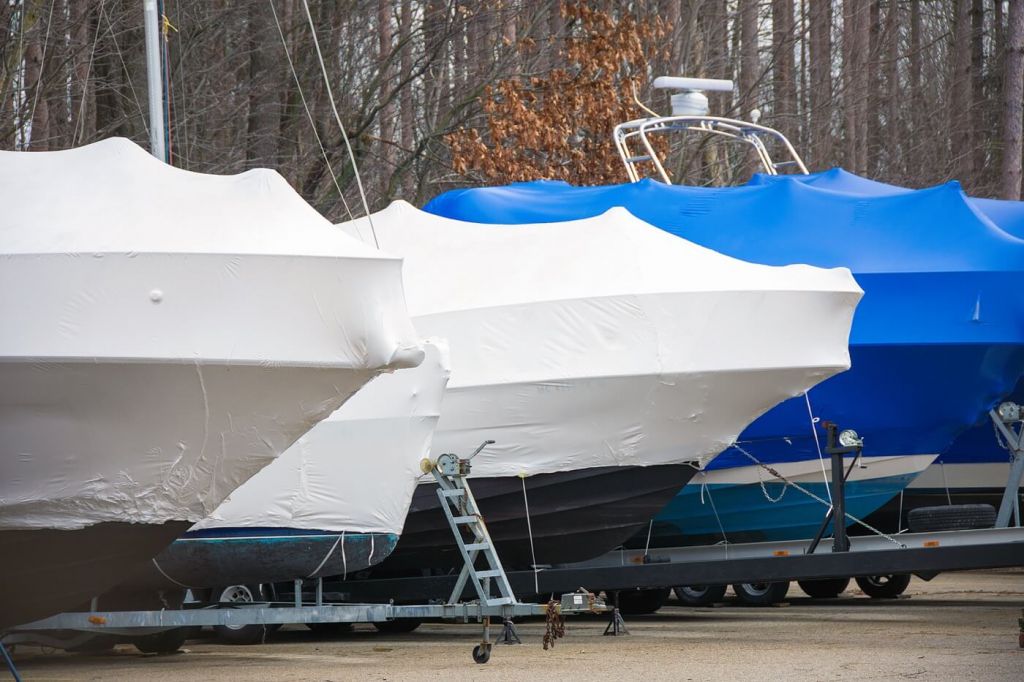 shrink wrapping a sailboat