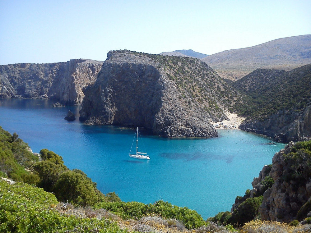 Sailboat of the coast of Rocky Sardinia
