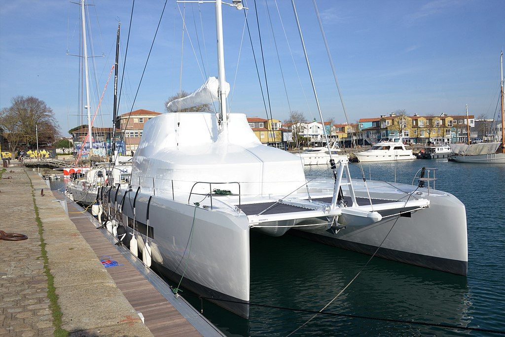 Catamaran at dock in white shrink wrap